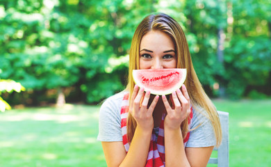 American girl eating watermelon