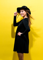 Happy young woman wearing a hat