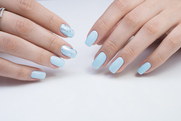 Women's hands and amazing natural nails. Ideal manicure with gel polish and nail art.