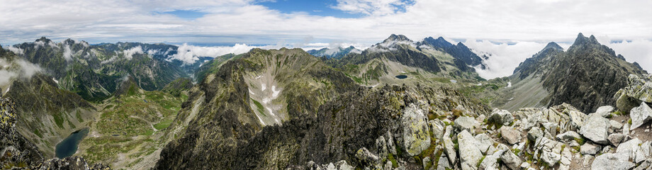 Summer panorama of mountains - valleys and ridges.