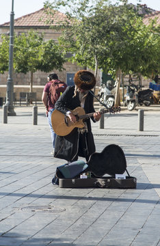 Jerusalem, Israel- June 8, 2017: Jewish orthodox playing in the guitar in Jerusalem, Israel