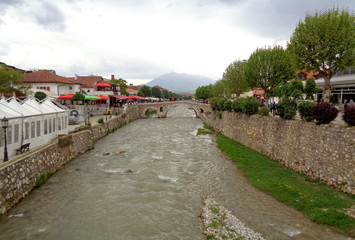 Fototapeta na wymiar Lumbardhi river and the famous stone bridge at the Old City of Prizren, Kosovo
