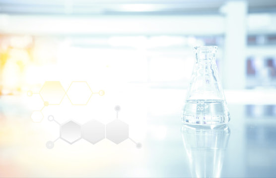 flask and chimical structure in science laboratory
