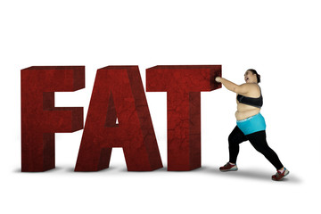 Obese woman crushing word of fat
