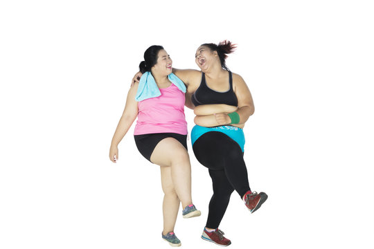 Overweight women workout together