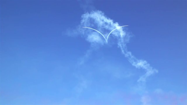 Aerobatic Team draws Heart shape in the sky during airshow