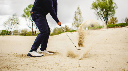 golfplayer hits a ball