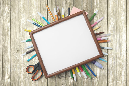 School supplies with empty frame on the table