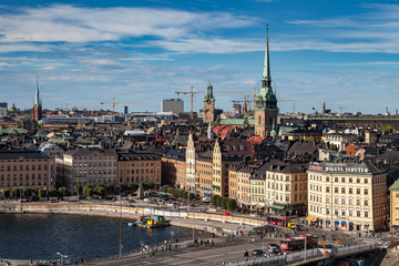 Fototapeta na wymiar STOCKHOLM, SWEDEN - SEPTEMBER, 16, 2016: Cityscape image during daytime with sun light. Old town panoramic view.
