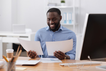 Nice pleasant man working in the office