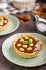 Fototapeta na wymiar Chocolate tartalets with nuts