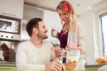 Young couple in kitchen together