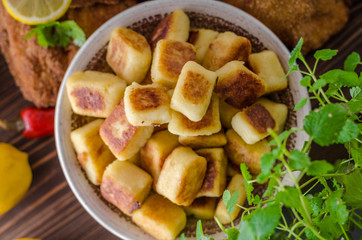 Schnitzel original with lemon and gnocchi fried
