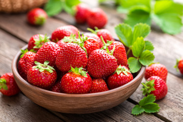 Fresh juicy strawberries with leaves. Strawberry. - obrazy, fototapety, plakaty