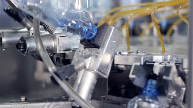 PET bottles being washed at bottled water plant.