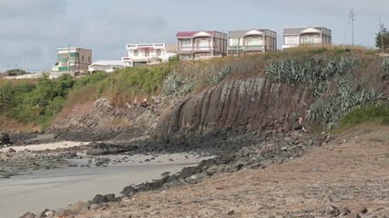 Houses near the shore of the beach of Penghu Island in Taiwan. Islas Pescadores is one of the best protected ecological areas in the world.