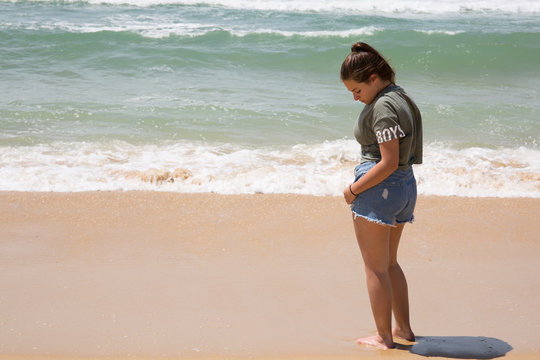alone girl teenager on beach