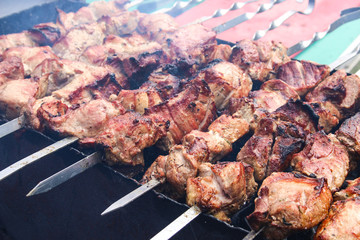 street food. Meat grilled on a skewer over charcoal. Shashlik