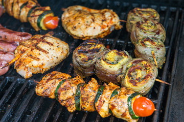 different meat and sausage on barbecue