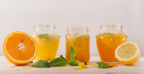 Fototapeta na wymiar Orange fresh and lemonade in jars