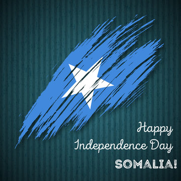 Somalia Independence Day Patriotic Design. Expressive Brush Stroke in National Flag Colors on dark striped background. Happy Independence Day Somalia Vector Greeting Card.