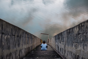 Young asian boy stay alone and sadness