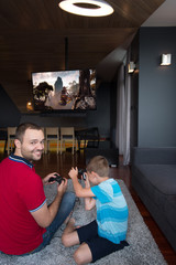 Happy family playing a video game