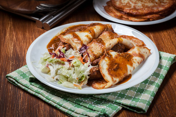 Potato pancakes with meat stew served