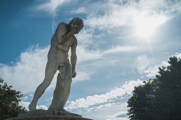 Statue holding head in hand