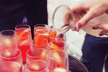 pour wine into glasses, round of drinks