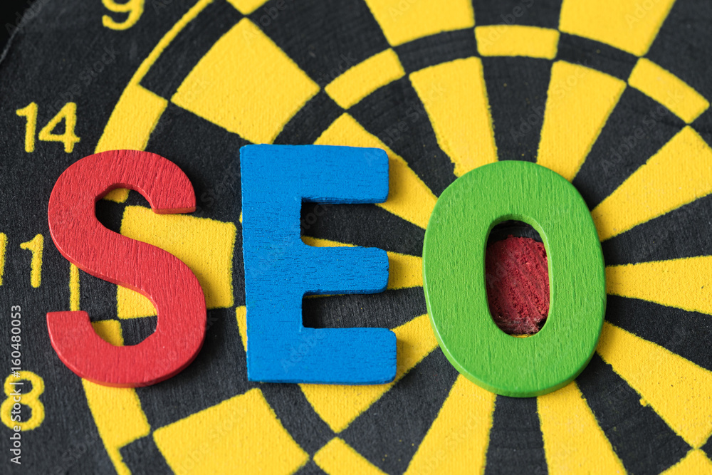 Poster seo search engine optimization concept as colorful alphabets abbreviation seo on dartboard