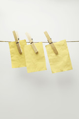 Yellow cards hanging, isolated on white