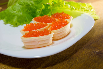 Delicious sandwiches with red caviar. Fresh bread for Breakfast.