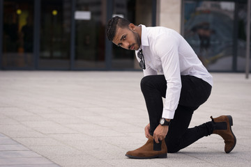 Black male portrait tying the laces