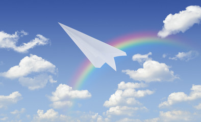 Plane paper flying over blue sky with rainbow, Business leader concept