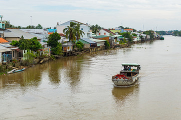 Wooden cargo boat on the Mekong River Delta