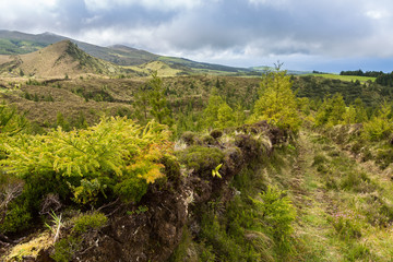 Landscape over blue and green lakes.