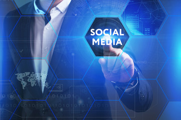 Business, Technology, Internet and network concept. Young businessman working on a virtual screen of the future and sees the inscription: Social media