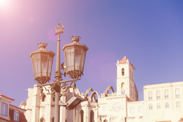 Fototapeta na wymiar Old street lamp on a classical facade in Lisbon