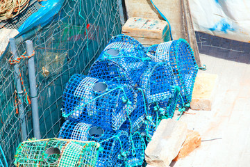 Lobster pots and crab pots drying in the sun on the pier, Cascais, Portugal