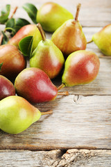 Ripe pears on grey wooden table