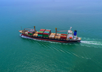 container ship in import export and business logistic.By crane ,Trade Port , Shipping, cargo to harbor, Aerial view, Top view.