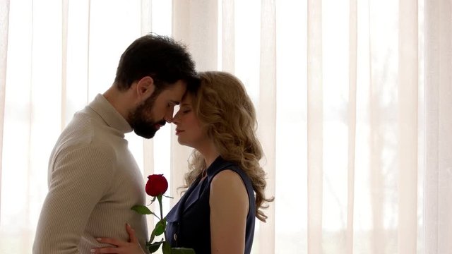 Couple with closed eyes. Man, woman and rose. Keep your love strong.