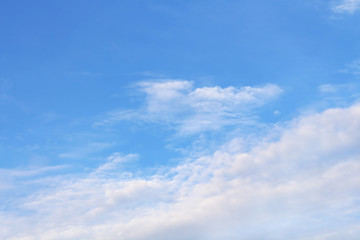 soft white clouds against blue sky.