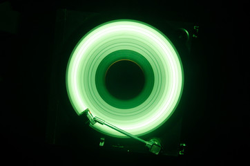 Concept of speed - Trail of fire and smoke - Vinyl record. Burning vinyl disk. Turntable vinyl record player. Retro audio equipment for disc jockey. Sound technology. Close up