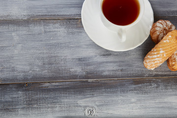 A cup of tea with biscuits