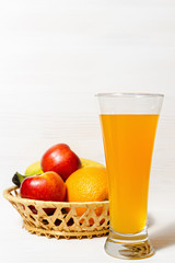 Fresh citrus juice with fruits on a wooden table