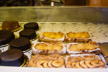 Tasty traditional sweets and pastries in italian shop