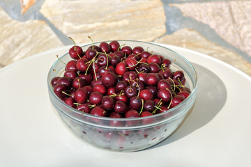 Hand picked cherries in round crystal bowl