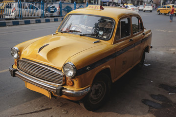 Yellow vintage taxi in Kolkata, India.